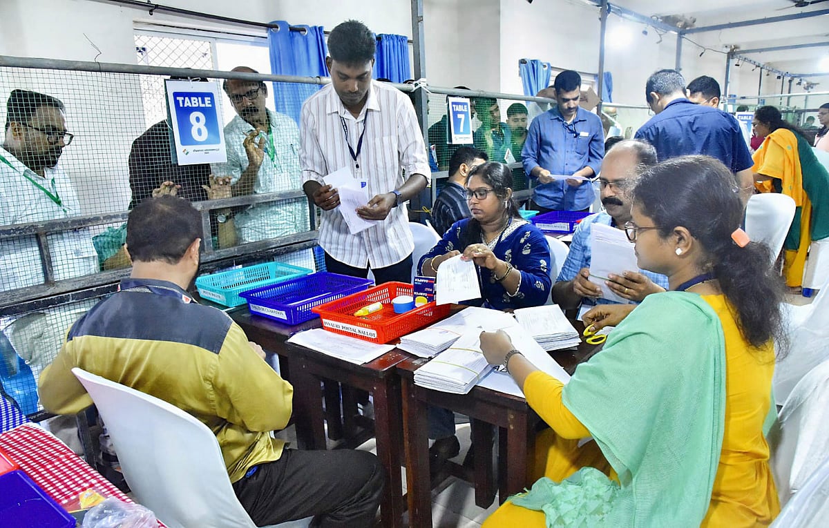 | Photo: PTI : Election officials count postal ballots during the first round of vote counting for the Assembly elections at a counting centre, in Kozhikode, Kerala.