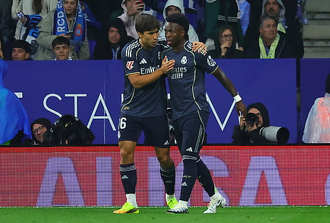 Real Madrid's Gonzalo Garcia, left, and Vinicius Junior celebrate after scoring during the La Liga soccer match between Espanyol and Real Madrid in Barcelona Spain.