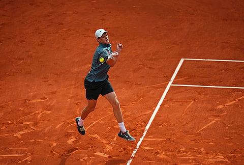 Jannik Sinner, of Italy, returns the ball to Alexander Zverev, of Germany, during their men's singles tennis final match at the Madrid Open tennis tournament in Madrid, Spain.