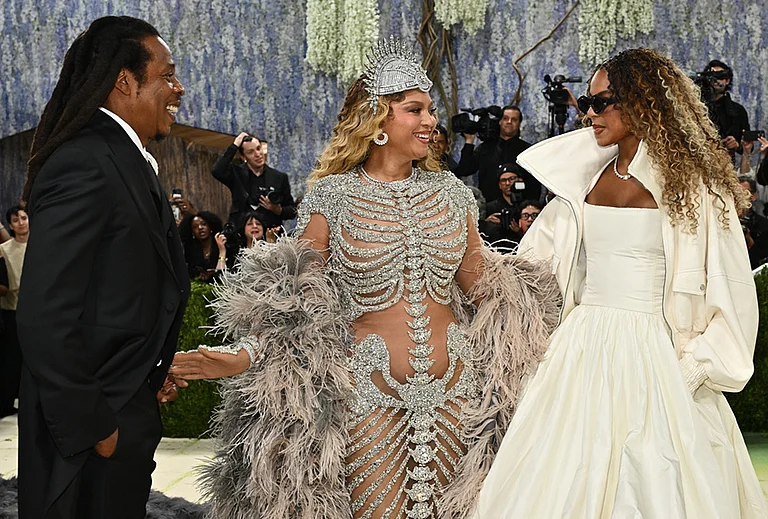 Jay-Z, from left, Beyoncé, and, Blue Ivy Carter arrive at The Metropolitan Museum of Art's Costume Institute benefit gala celebrating the opening of the "Costume Art" exhibition in New York. - | Photo: Evan Agostini/Invision/AP