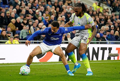 Everton's Iliman Ndiaye, left, and Manchester City's Antoine Semenyo fight for the ball during the Premier League soccer match between Manchester City and Everton in Liverpool, England.