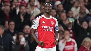 AP Photo : Arsenal's Bukayo Saka celebrates after scoring the opening goal during a Champions League semifinal, second leg, soccer match between Arsenal FC and Atletico Madrid in London.