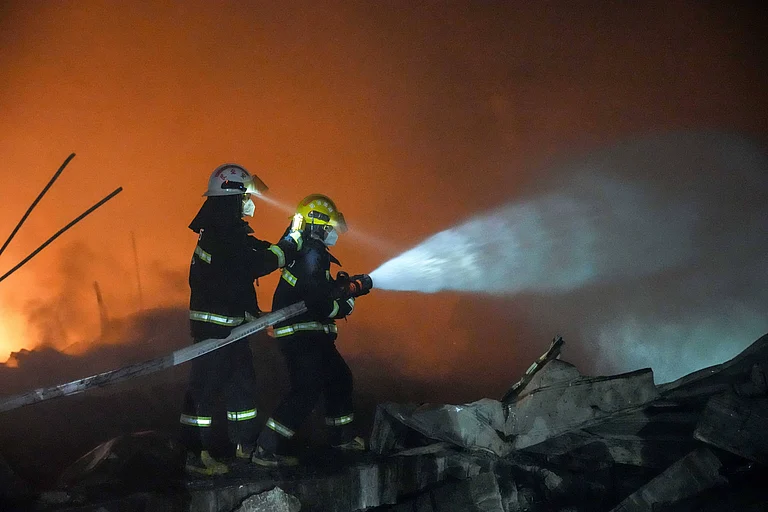 Rescuers work on site after an explosion at a fireworks plant in Guandu Town of Liuyang, central China s Hunan Province, in the early hours of May 5, 2026. - null