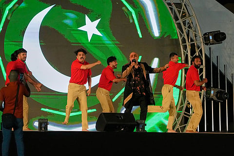 Pakistan's pop singer Ali Azmat, center, performs in a ceremony before start of the Pakistan Super League final cricket match between Peshawar Zalmi and Hyderabad Kingsmen, in Lahore, Pakistan, Sunday, May 3, 2026. (