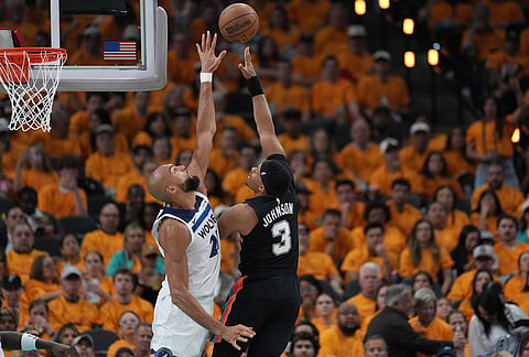 San Antonio Spurs forward Keldon Johnson (3) shoots over Minnesota Timberwolves center Rudy Gobert (27) during the second half in Game 1 of a second-round NBA playoffs basketball series in San Antonio