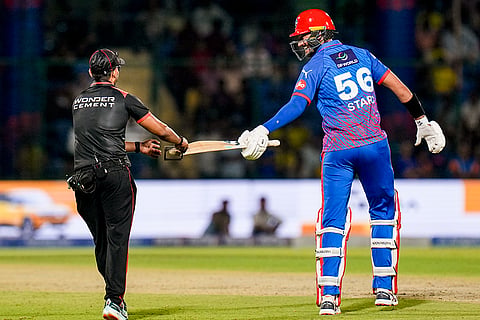 Delhi Capitals’ Mitchell Starc gets his bat checked during the Indian Premier League (IPL) 2026 T20 cricket match between Delhi Capitals and Chennai Super Kings, in New Delhi.