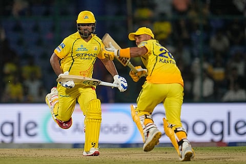 Chennai Super Kings' Sanju Samson and Kartik Sharma run between the wickets to score during the Indian Premier League cricket match between Chennai Super Kings and Delhi Capitals in New Delhi.