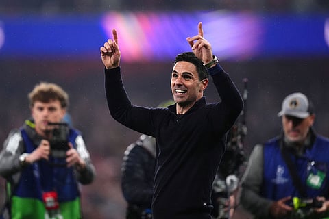 Arsenal's manager Mikel Arteta celebrates at the the end of a Champions League semifinal, second leg, soccer match between Arsenal FC and Atletico Madrid in London.