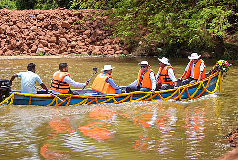 Goa Chief Minister Pramod Sawant, third right, rides a boat during the inspection of improvement works of the Tar-Moira river waterway along with WRD Minister Subhash Shirodkar, MLA Kedar Naik and officials of the Water Resources Department, in Panaji. 