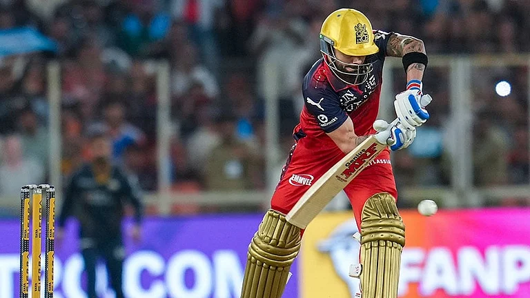 Royal Challengers Bengaluru's Virat Kohli plays a shot during the Indian Premier League (IPL) 2026 T20 cricket match between Gujarat Titans and Royal Challengers Bengaluru, in Ahmedabad, Gujarat. - | Photo: PTI/Arun Sharma