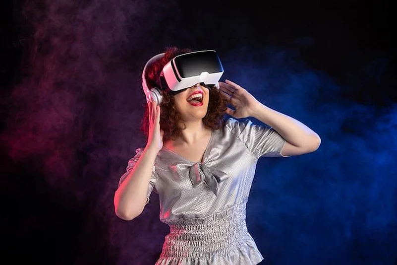 Woman wearing a VR headset and headphones in smoky light