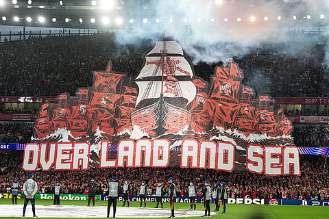 A banner hangs from the stadium roof before the start of a Champions League semifinal, second leg, soccer match between Arsenal FC and Atletico Madrid in London.