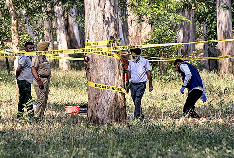Forensic experts inspect the blast site close to the Army cantonment area at Khasa, in Amritsar district.