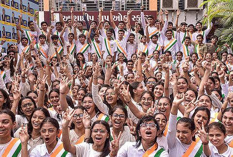 Students celebrate after the result declaration of Gujarat SSC (GSEB) board of class 10th, in Surat, Gujarat.