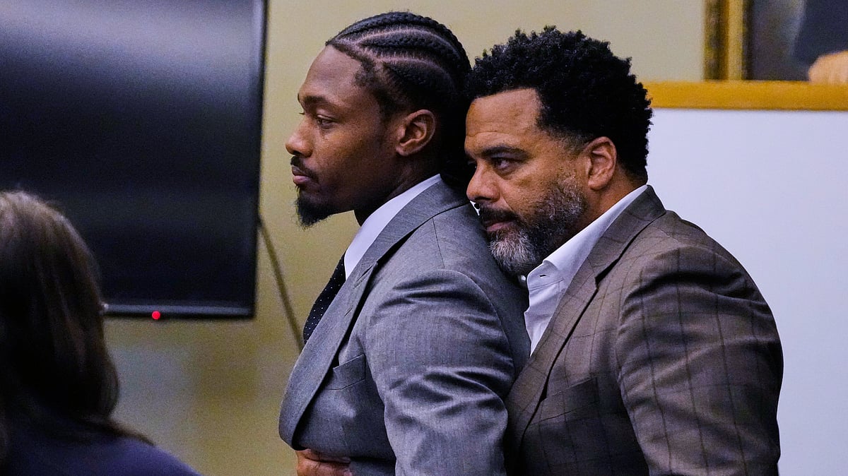 (AP Photo/Charles Krupa, Pool) : Former New England Patriots wide receiver Stefon Diggs, left, is embraced after a not guilty verdict at his trial at Norfolk County District Court, Tuesday, May 5, 2026, in Dedham, Mass.