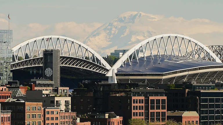 Mount Rainier is seen in the distance overlooking Lumen Field as seen from Pike Place Market, Saturday, April 25, 2026, in Seattle. - | Photo: AP/Lindsey Wasson