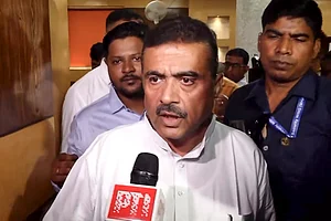PTI : BJP leader Suvendu Adhikari speaks to the media on the Assembly election results day, in Kolkata.