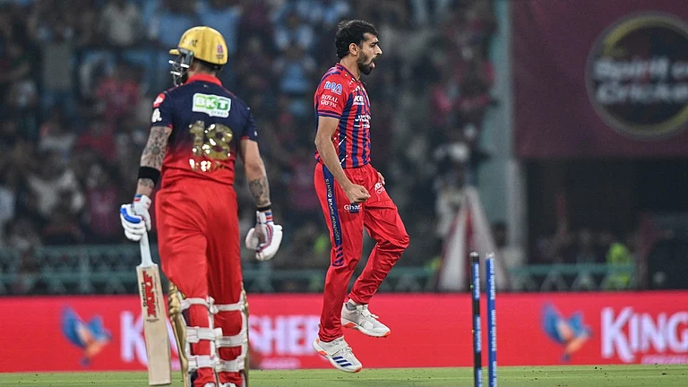 Lucknow Super Giants' Prince Yadav, right, celebrates the wicket of Royal Challengers Bengaluru's Virat Kohli, left, during the Indian Premier League cricket match between Royal Challengers Bengaluru and Lucknow Super Giants in Lucknow, India, Thursday, May 7, 2026. - AP Photo