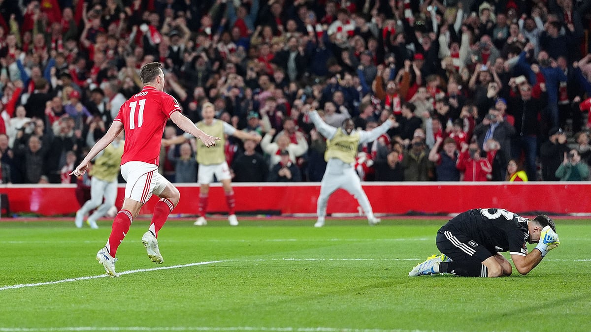 | Photo: AP/David Davies : Nottingham Forest's Chris Wood, left, celebrates after scoring the opening goal from a penalty during the Europa League semifinal first leg soccer match between Nottingham Forest and Aston Villa in Nottingham, England, Thursday, April 30, 2026. (
