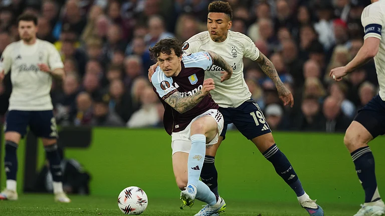 Aston Villa's Victor Lindeloef, left, and Nottingham Forest's Igor Jesus fight for the ball during the Europa League second-leg semifinal match - AP/Dave Shopland