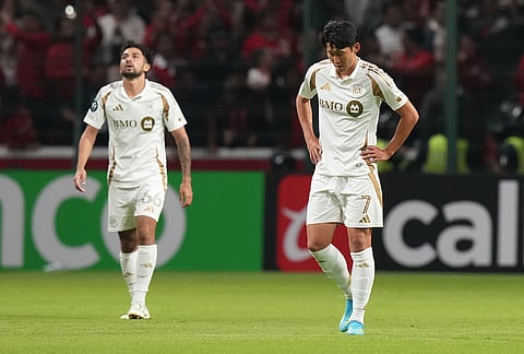 Son Heung-Min, right, and Mathieu Choiniere of the United States' Los Angeles FC react after Everardo Lopez of Mexico's Toluca scored during a CONCACAF Champions Cup second leg semifinal soccer match in Toluca, Mexico.