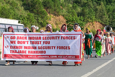 People from various communities take part in a peace rally demanding justice and protection of human rights, in Waithou area of Thoubal district, Manipur.