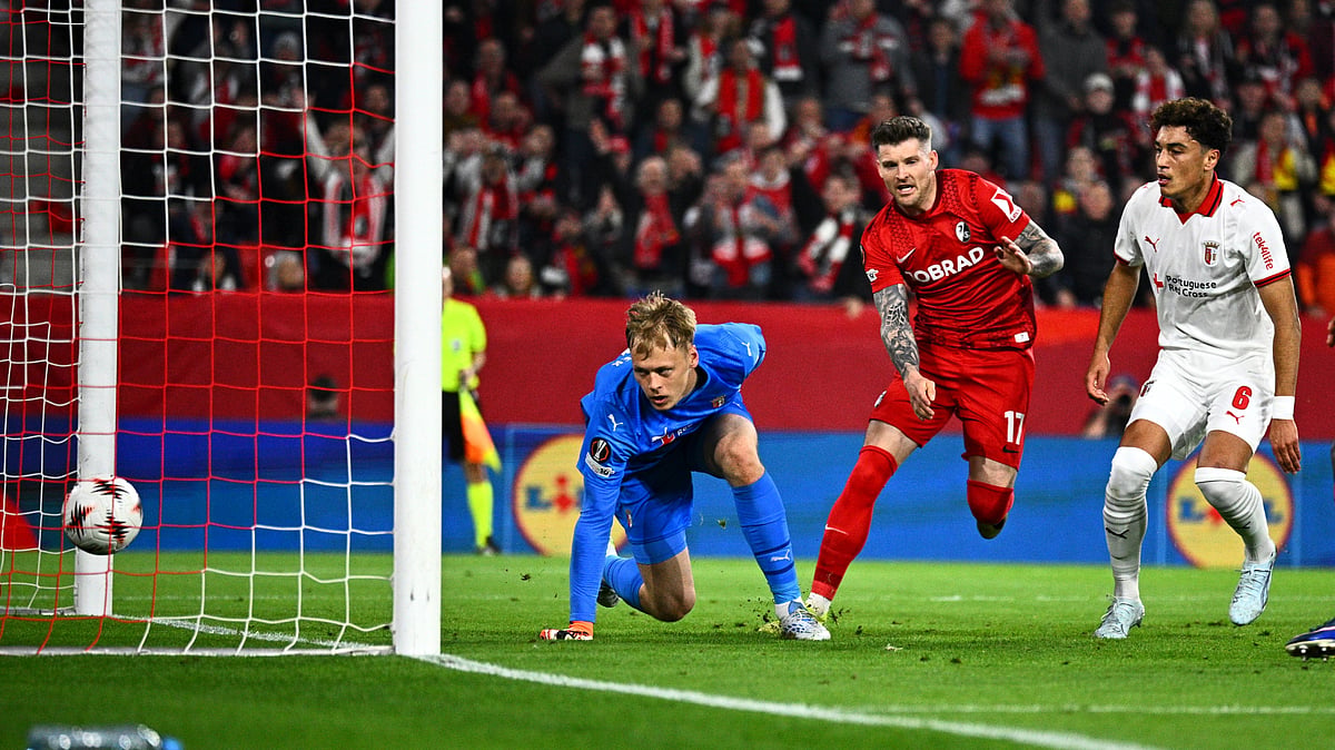Freiburg's Lukas Kubler, center, scores a goal during the Europa League second leg semifinal soccer match between SC Freiburg and SC Braga - Tom Weller/dpa via AP