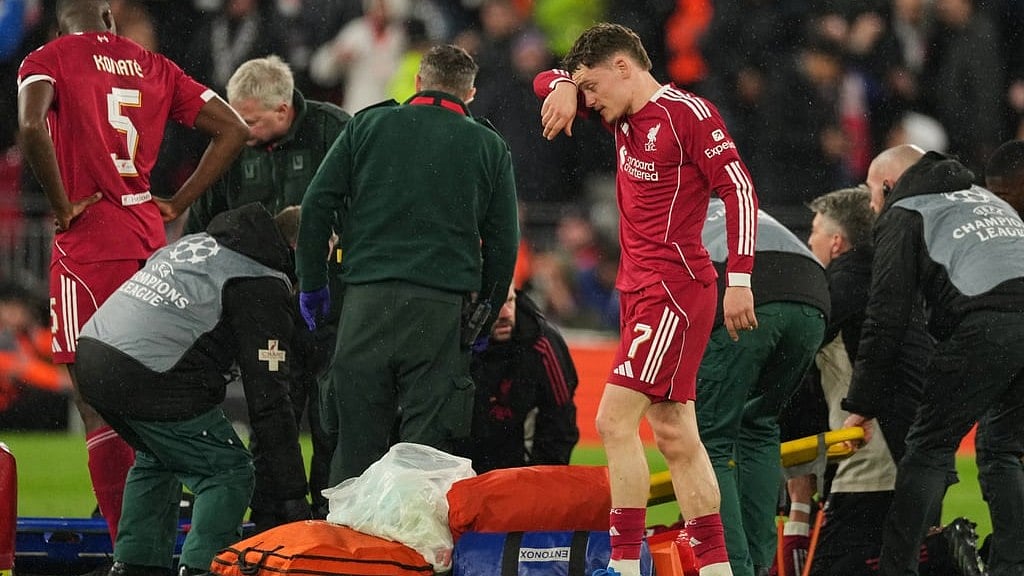 Liverpool's Florian Wirtz reacts as she stretcher comes out for teammate Hugo Ekitike during the Champions League quarterfinal second leg soccer match between Liverpool and Paris Saint-Germain in Liverpool, England, Tuesday, April 14, 2026. - AP Photo/Dave Shopland