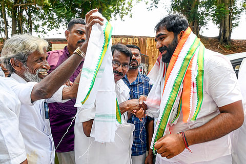 Former Kerala Chief Minister Oommen Chandy's son and UDF candidate from Puthupally constituency Chandy Ommen being welcomed by party workers during an event, in Thiruvananthapuram.