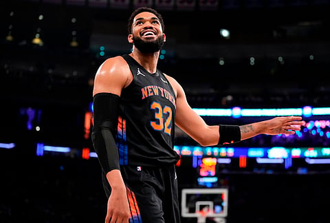 New York Knicks center Karl-Anthony Towns reacts after giving a foul during the second half of Game 2 in a second-round NBA basketball playoffs series against the Philadelphia 76ers, in New York. 