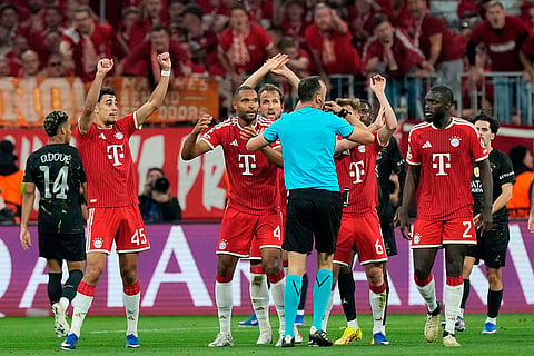 Bayern players react after referee Joao Pinheiro's decision during the Champions League semifinal second leg soccer match between Bayern Munich and Paris Saint Germain in Munich, Germany.