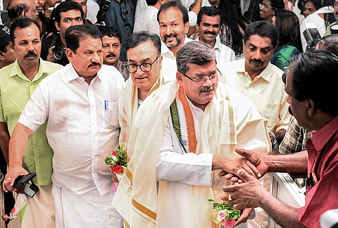 AICC observers Ajay Maken and Mukul Wasnik being received by Congress workers upon their arrival for the meeting of the Congress Legislature Party (CLP) to decide on the chief ministerial candidate in Kerala, at the party headquarters, in Thiruvananthapuram.