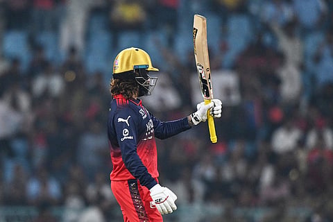 Royal Challengers Bengaluru's captain Rajat Patidar celebrates his fifty runs during the Indian Premier League cricket match between Royal Challengers Bengaluru and Lucknow Super Giants in Lucknow, India.