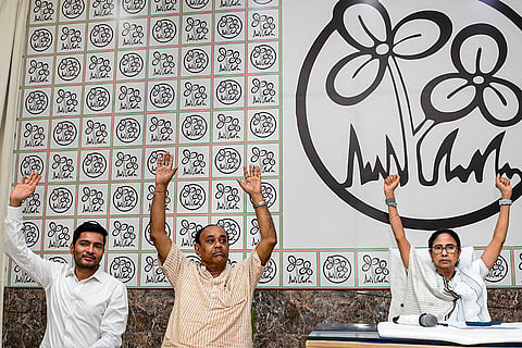 In this image posted on May 6, 2026, TMC supremo Mamata Banerjee, right, party General Secretary Abhishek Banerjee, left, and others during a party meeting, at Kalighat, in Kolkata.