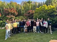 Palash Kala with a group of people in a park