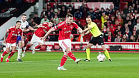 | Photo: Mike Egerton/PA via AP : Nottingham Forest's Chris Wood scores their side's first goal from a penalty during the Europa League semifinal first leg soccer match between Nottingham Forest and Aston Villa in Nottingham, England.