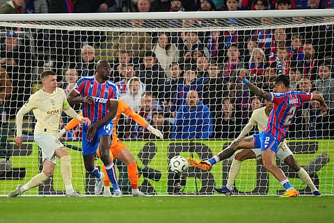 Crystal Palace's Daniel Munoz, right, kicks the ball during the Conference League semifinal second leg soccer match between Crystal Palace and Shakhtar Donetsk, in London.