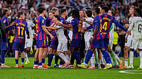 File/AP : Real Madrid and Barcelona players scuffle during a Spanish La Liga match in Madrid.