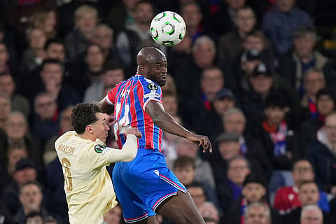 Crystal Palace's Jean-Philippe Mateta, right, and Shakhtar's Marlon Gomes challenge for the ball during the Conference League semifinal second leg soccer match between Crystal Palace and Shakhtar Donetsk, in London.