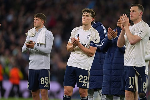 Nottingham Forrest players walk off the pitch after the Europa League second-leg semifinal soccer match between Aston Villa and Nottingham Forrest in Birmingham, England.