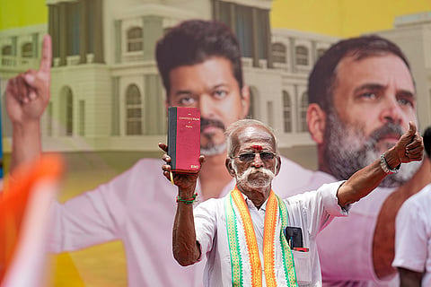 A Congress worker during a protest against the Governor over not inviting Tamilaga Vettri Kazhagam (TVK) chief Vijay to form the government, in Chennai.