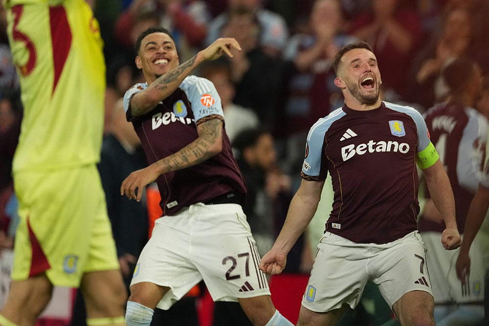 Aston Villa's John McGinn, right, and Morgan Rogers react after the Europa League second-leg semifinal soccer match between Aston Villa and Nottingham Forest in Birmingham, England. - | Photo: AP/Dave Shopland