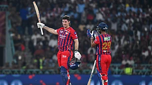 (AP Photo) : Lucknow Super Giants' Mitchell Marsh, left, celebrates his century with his batting partner Nicholas Pooran during the Indian Premier League cricket match between Royal Challengers Bengaluru and Lucknow Super Giants in Lucknow, India, Thursday, May 7, 2026.