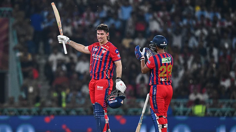 Lucknow Super Giants' Mitchell Marsh, left, celebrates his century with his batting partner Nicholas Pooran during the Indian Premier League cricket match between Royal Challengers Bengaluru and Lucknow Super Giants in Lucknow, India, Thursday, May 7, 2026. - (AP Photo)