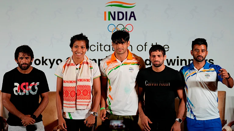 From left, Olympic Bronze medallist in wrestling Bajarng Punia, Olympic Bronze medallists in boxing, Lovlina Borgohain, Olympic Gold medallist in javelin throw Neeraj Chopra, Olympic Silver medallist in wrestling Ravi Dahiya and captain of Indian men's hockey team who won bronze medal, Manpreet Singh at Tokyo Olympic games, stand for a photographs during a felicitation function in New Delhi, India, Monday, Aug. 9 2021. - | Photo: AP/Manish Swarup