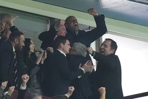 Britain's Prince William, Prince of Wales, rear center, celebrates Aston Villa's third goal during the Europa League soccer match between Aston Villa and Nottingham Forest Birmingham, England.