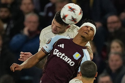 Nottingham Forest's Morato, back, and Aston Villa's Ollie Watkins jump for the ballduring the Europa League second-leg semifinal soccer match between Aston Villa and Nottingham in Birmingham, England.