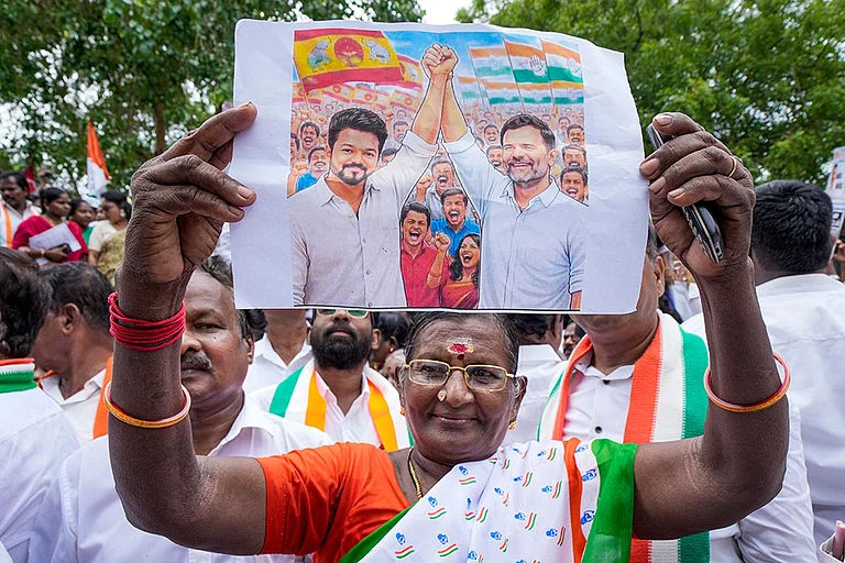 A Congress worker during a protest against the Governor over not inviting Tamilaga Vettri Kazhagam (TVK) chief Vijay to form the government, in Chennai. - | Photo: PTI/R Senthilkumar