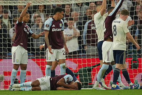 Aston Villa's Ollie Watkins reacts after a collision during the Europa League second-leg semifinal soccer match between Aston Villa and Nottingham in Birmingham, England.