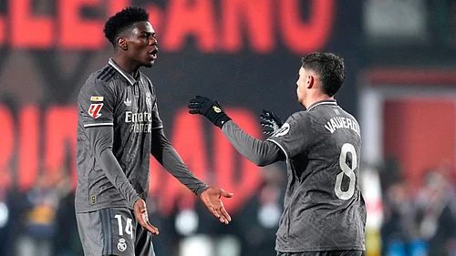 File/AP : Federico Valverde, right, celebrates with Aurelien Tchouameni after scoring his sides opening goal during the La Liga match between Rayo Vallecano and Real Madrid.